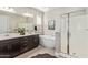 Elegant bathroom featuring double vanities, a soaking tub, and a glass-enclosed shower at 22891 E Via Del Sol --, Queen Creek, AZ 85142