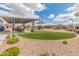 Community playground with covered picnic tables and lots of space for to play at 2460 E Athena Ave, Gilbert, AZ 85297