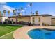 Poolside view of covered patio with outdoor seating; perfect for entertainment and leisure at 2638 E Edgemont Ave, Phoenix, AZ 85008