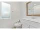 Bright bathroom with a window and vanity with storage at 2638 E Edgemont Ave, Phoenix, AZ 85008