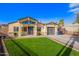 Charming home with a well-maintained lawn, modern garage door, and covered front entrance at 2638 E Edgemont Ave, Phoenix, AZ 85008