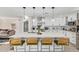 Elegant kitchen island featuring modern pendant lighting, quartz countertops, and stylish seating at 2638 E Edgemont Ave, Phoenix, AZ 85008