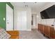 Living room featuring a modern credenza and view of a closet at 2638 E Edgemont Ave, Phoenix, AZ 85008