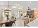 Bright open-concept living room and dining area with a modern design and neutral color palette at 2638 E Edgemont Ave, Phoenix, AZ 85008