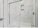 Beautiful bathroom shower features a tiled shower with glass door at 2638 E Edgemont Ave, Phoenix, AZ 85008