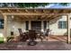 Covered back patio boasts a beautiful brick floor, outdoor seating, and ceiling fan for comfortable outdoor living at 2824 N 42Nd Way, Phoenix, AZ 85008