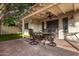 Covered back patio with ceiling fan features a beautiful brick floor, outdoor seating, and natural shade at 2824 N 42Nd Way, Phoenix, AZ 85008