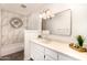 Modern bathroom with a tub-shower combo with decorative tile and a large vanity with double sinks at 2824 N 42Nd Way, Phoenix, AZ 85008