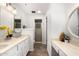 Bright bathroom with a double sink, decorative accents, and a glass shower at 2824 N 42Nd Way, Phoenix, AZ 85008