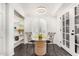 Cozy breakfast nook with a glass table, French doors, and a built-in shelving unit at 2824 N 42Nd Way, Phoenix, AZ 85008