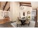 Open dining room featuring wood floors, high ceilings, modern lighting, and adjacent laundry room at 2824 N 42Nd Way, Phoenix, AZ 85008