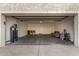 Spacious garage featuring bright lighting, epoxy flooring, and ample storage at 2824 N 42Nd Way, Phoenix, AZ 85008