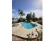 Community pool area boasts clean water, lounge chairs, a shaded structure, and desert landscaping at 2824 N 42Nd Way, Phoenix, AZ 85008