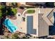 Aerial perspective of a home with a pool, manicured backyard, and solar panels, highlighting sustainability at 2977 E Teakwood Pl, Chandler, AZ 85249