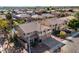 Aerial view showcasing a backyard with a swimming pool, landscaped backyard, and nearby neighborhood at 2977 E Teakwood Pl, Chandler, AZ 85249