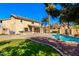 Spacious backyard featuring a pool, grassy area, desert landscaping, and covered patio at 2977 E Teakwood Pl, Chandler, AZ 85249