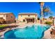 Inviting backyard with a refreshing pool, lush lawn, and a covered patio at 2977 E Teakwood Pl, Chandler, AZ 85249