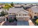 Beautiful two-story home with a well-manicured front yard and a two-car garage in a lovely suburban neighborhood at 2977 E Teakwood Pl, Chandler, AZ 85249