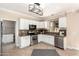 Well-equipped kitchen featuring white cabinets, granite countertops, and stainless steel appliances at 2977 E Teakwood Pl, Chandler, AZ 85249