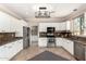 Well-lit kitchen with white cabinets, stainless steel appliances, and granite countertops at 2977 E Teakwood Pl, Chandler, AZ 85249