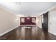 Living room featuring wood floors, ample natural light, and a sliding barn door at 2977 E Teakwood Pl, Chandler, AZ 85249