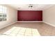 Spacious living room boasting neutral-toned walls, tile floors, a modern ceiling fan, and ample natural light at 2977 E Teakwood Pl, Chandler, AZ 85249