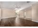 Spacious living room featuring hardwood floors and staircase access to the second floor at 2977 E Teakwood Pl, Chandler, AZ 85249