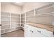 Well-organized pantry with shelving, cabinets, and butcher block countertop at 2977 E Teakwood Pl, Chandler, AZ 85249