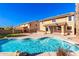 Backyard with sparkling pool, patio, and lush landscaping creates a serene outdoor living space at 2977 E Teakwood Pl, Chandler, AZ 85249