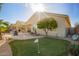 Backyard boasts a putting green, a fountain and a covered patio at 30153 N Gecko Trl, San Tan Valley, AZ 85143