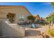 Wide backyard view featuring pavers, landscaping and a tranquil fountain at 30153 N Gecko Trl, San Tan Valley, AZ 85143