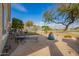 Backyard patio with paver flooring, mature landscaping and clear blue skies at 30153 N Gecko Trl, San Tan Valley, AZ 85143