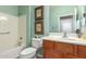 Bathroom featuring a wood vanity, framed art and neutral paint color at 30153 N Gecko Trl, San Tan Valley, AZ 85143