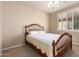 Cozy bedroom features a shuttered window, neutral paint and carpet at 30153 N Gecko Trl, San Tan Valley, AZ 85143