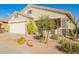 Charming single-story home with desert landscaping, stone accents, and a well-manicured lawn at 30153 N Gecko Trl, San Tan Valley, AZ 85143