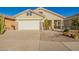 Inviting home with neutral stucco, river rock accents, desert landscaping and a 2 car garage at 30153 N Gecko Trl, San Tan Valley, AZ 85143