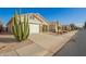 Well-maintained single-story home with desert landscaping and a two-car garage at 30153 N Gecko Trl, San Tan Valley, AZ 85143