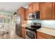 Well-equipped kitchen with stainless steel appliances and adjacent breakfast nook at 30153 N Gecko Trl, San Tan Valley, AZ 85143