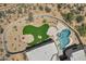 Overhead view of the home's backyard with a private pool and an artificial turf area, complete with a fire pit at 30600 N Pima Rd # 24, Scottsdale, AZ 85266