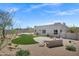 Well-manicured backyard with landscaped spaces and gravel at 30600 N Pima Rd # 24, Scottsdale, AZ 85266