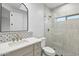 Updated bathroom featuring a vanity, shower, and tile and neutral color palette at 30600 N Pima Rd # 24, Scottsdale, AZ 85266