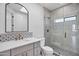 Bathroom with marble countertops, decorative tile backsplash, and glass-enclosed shower at 30600 N Pima Rd # 24, Scottsdale, AZ 85266