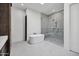Modern bathroom featuring soaker tub and glass shower with dual shower heads at 30600 N Pima Rd # 24, Scottsdale, AZ 85266