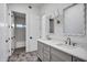 Bathroom featuring double vanity, marble countertops, and unique tile flooring at 30600 N Pima Rd # 24, Scottsdale, AZ 85266