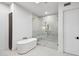 Bright bathroom featuring a modern soaking tub and glass-enclosed shower with bronze fixtures at 30600 N Pima Rd # 24, Scottsdale, AZ 85266