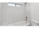 Bright bathroom with a white tub, shower and toilet at 30600 N Pima Rd # 24, Scottsdale, AZ 85266