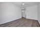 Minimalist bedroom with wood flooring and ensuite bathroom access at 30600 N Pima Rd # 24, Scottsdale, AZ 85266