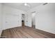 Spacious bedroom featuring modern ceiling fan, wood flooring, and ensuite access at 30600 N Pima Rd # 24, Scottsdale, AZ 85266