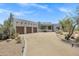 Beautiful Southwestern home with a three-car garage, complemented by drought-tolerant desert landscaping at 30600 N Pima Rd # 24, Scottsdale, AZ 85266
