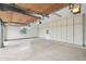 Well-organized garage featuring abundant storage cabinets and a clean, epoxy-coated floor at 30600 N Pima Rd # 24, Scottsdale, AZ 85266